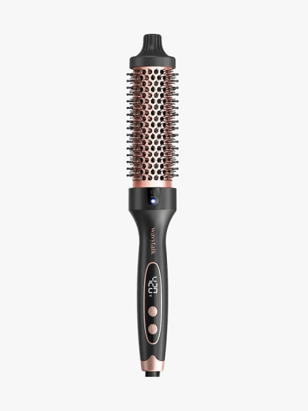 Black buttoned brush with heating component on a light gray background